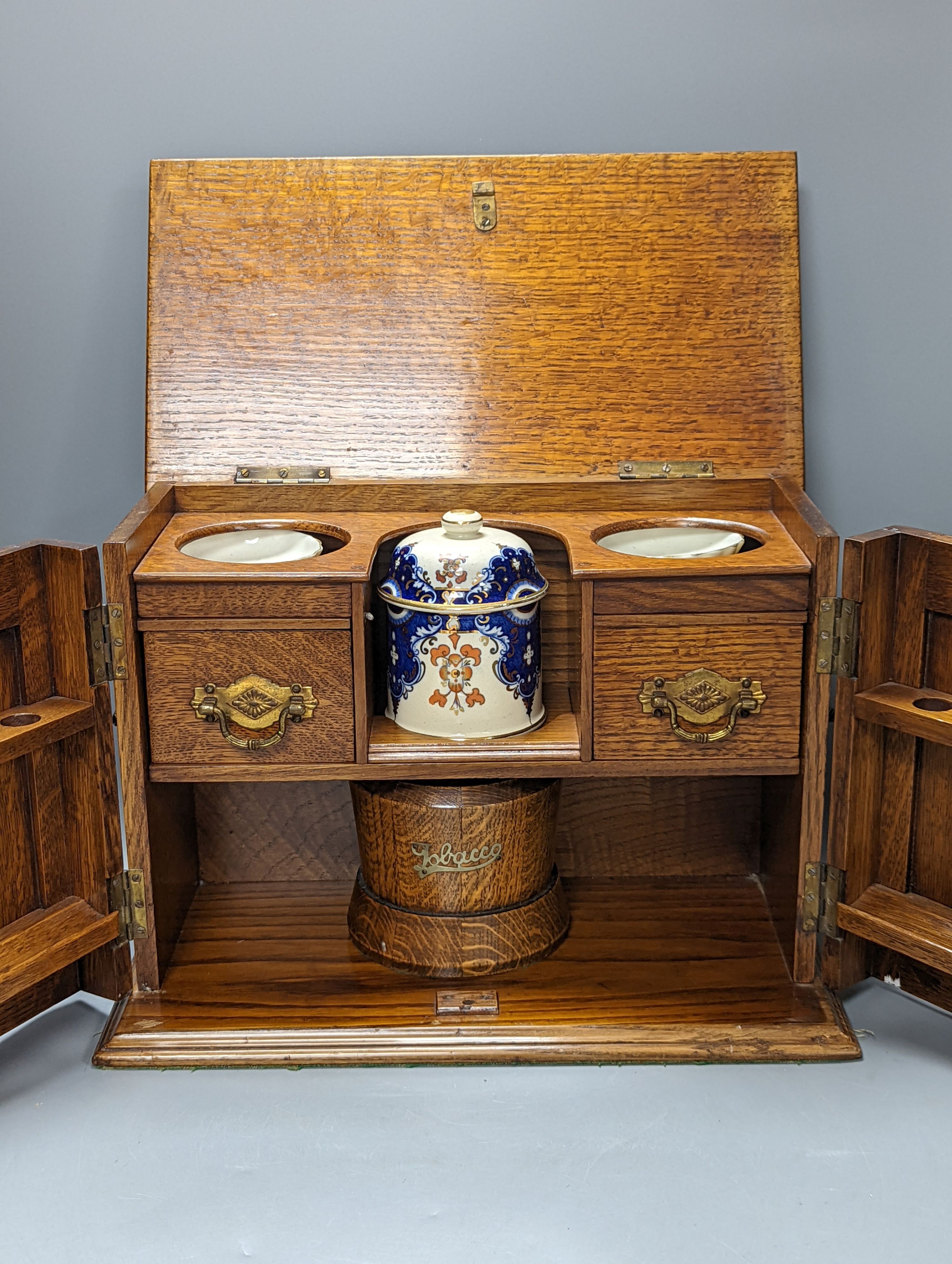 A carved oak smoker's cabinet 38cm